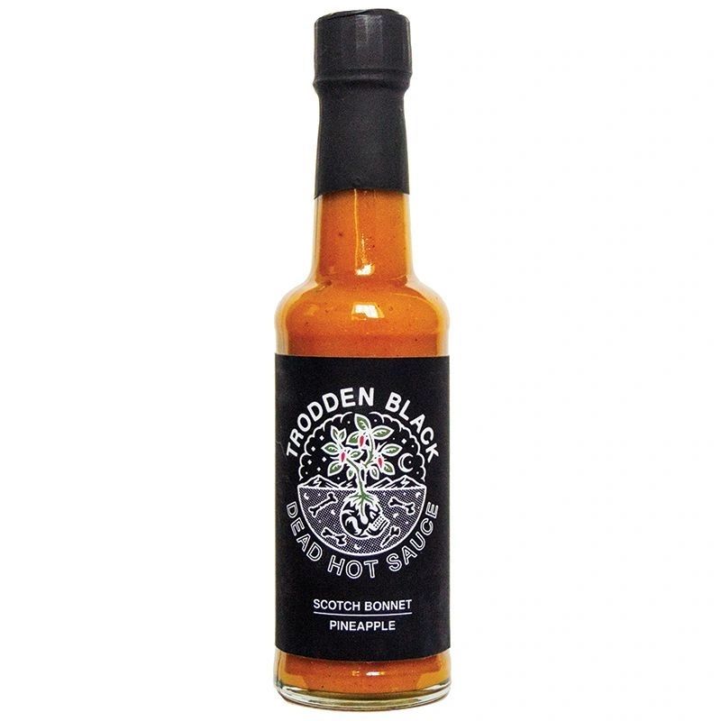 bottle of Trodden Black scotch bonnet and pineapple hot sauce